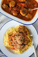 Delicious homemade meat balls in tomato sauce with spaghetti. Top view