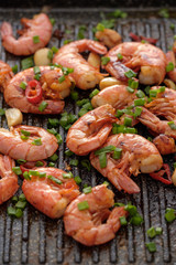Large grilled BBQ shrimp with sweet chili sauce, green onion and lemon.