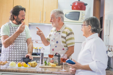 Family cooking at home with fun