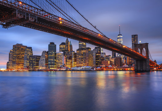 View of Lower Manhattan skyline with Brooklyn Bridge in foreground