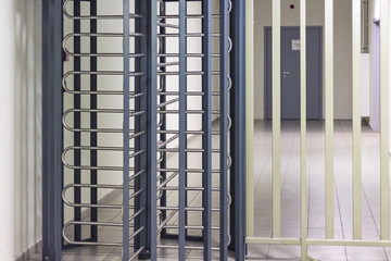 Metal turnstile for workers at the airport. Increased safety