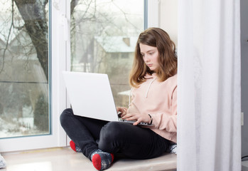 teenager girl using laptop, online shopping