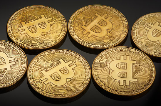 Golden bitcoin coin. Crypto currency golden coin bitcoin symbol on black background.