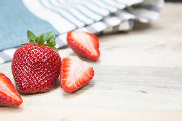 Fresh strawberry on wooden background.