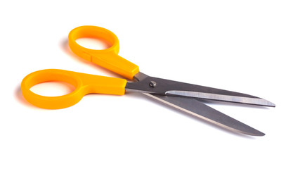 Yellow scissors isolated on a white background