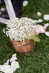 Flowers on Wine Barrel at Wedding Ceremony