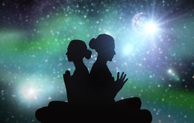 black silhouette of couple meditating over space