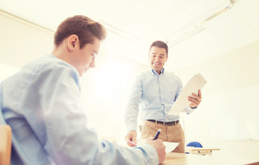 group of students and teacher with test results
