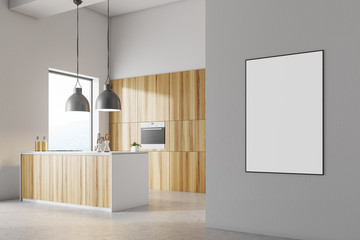 White kitchen interior, wooden countertops, poster