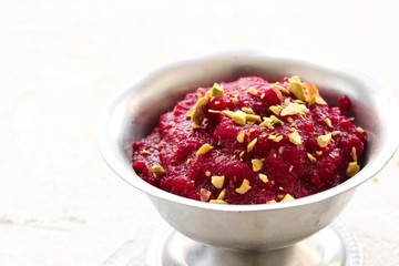 Homemade Beetroot Halwa with Pistachio garnish, selective focus