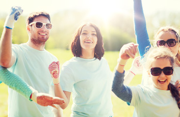 group of volunteers celebrating success in park