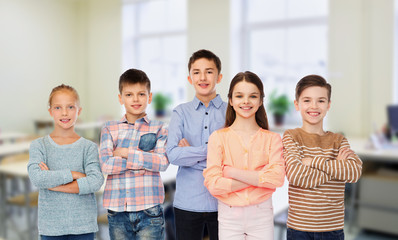 happy students at school over classroom background