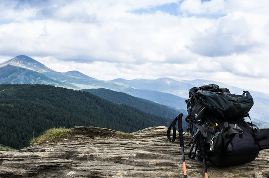 Tourist backpack in the background of mountains. Traveling with a backpack.