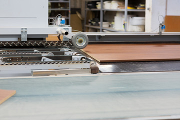 chipboards on conveyer at furniture factory