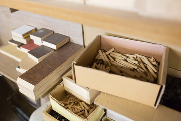 wood dowel pins and board samples at workshop