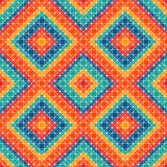Bright stained glass mosaic background. Seamless pattern with kaleidoscope geometric print. Mexican thread craft motif