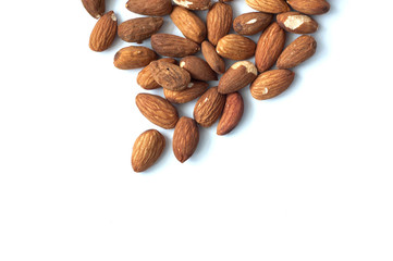 A lot of almond grains on a white background.