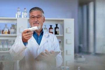 Senior chemistry professor/doctor in a lab (color toned image)