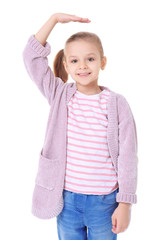 Little girl measuring height on white background