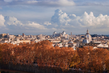 Fototapeta na wymiar Rome historic center autumn or winter skyline view, with famous landmarks, ancient monuments, old church domes and clouds