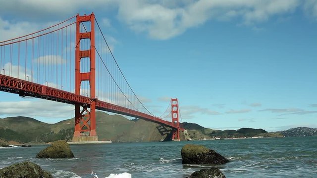 San Francisco's Golden Gate Bridge with blue skies and waves  Royalty free stock video