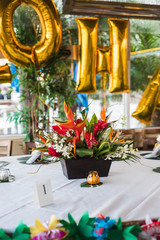 Fototapeta na wymiar Hawaiian Flower Centerpiece Event Table 