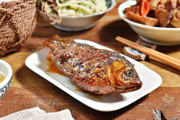 Braised crucian carp with scallion , Chinese cuisine