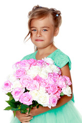 Little girl with a bouquet of flowers