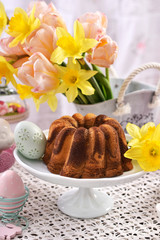 easter festive table with marble ring cake and decorations