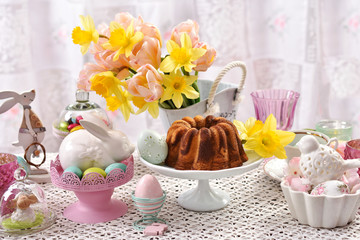easter festive table with marble ring cake and decorations