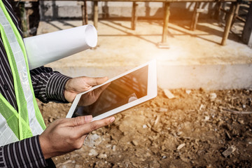 construction engineer worker using tablet computer at building site