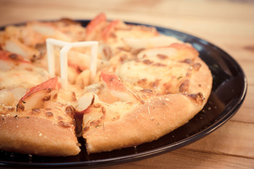 Pizza be appetizing on wooden background.