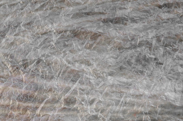 Texture of cellophane material with many folds and bends