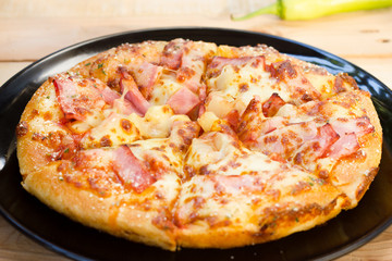 Pizza be appetizing on wooden background.