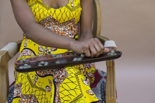 Woman playing Awale game
