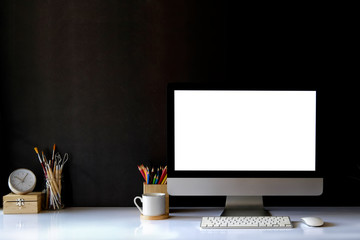 Mockup of creative desktop of designer at dark interior workplace.