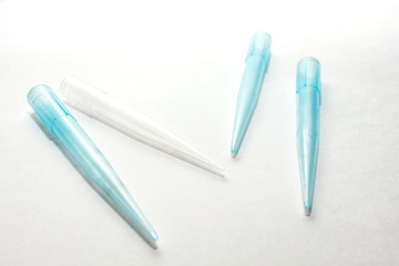 A blue disposable micro pipette tips for lab or laboratory on white background