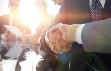 handshake of business partners in conference room