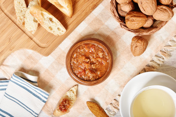 Tomato beef sauce with bread on wooden table