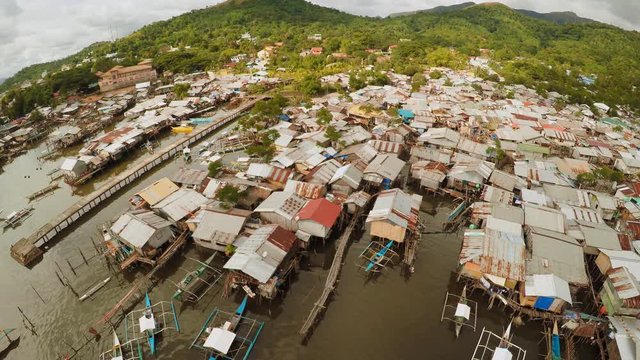 Philippine slums on the beach. Poor area of the city. Coron. Palawan. Philippines.