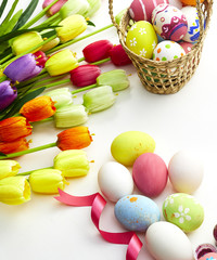 Decorated eggs and spring flowers tulips