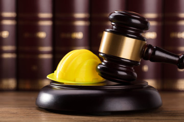 Close-up Of Gavel And Hard Hat