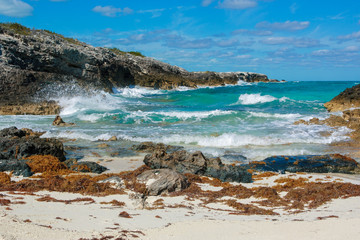 Fototapeta na wymiar A view of the surf on the rocky Atlantic side of Warderick Wells Cay in Exumas, Bahamas.
