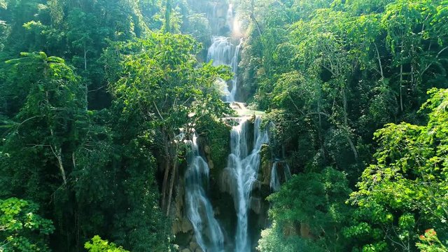 4k Video shot aerial view by drone. Kuang Si Waterfall Famous Landmark Nature Travel Place Of Luang Prabang City, Laos. Bird eye view landscape.