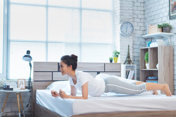 Asian women exercising in bed in the morning, she feels refreshed.She acted plank