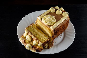 delicious home made biscuit cake on a black background