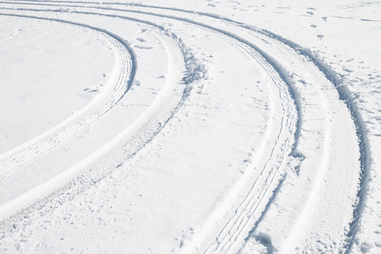 Car tire track in snow