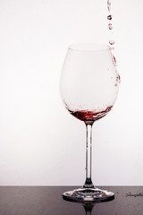 Pouring water to wine glass