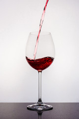 Pouring water to wine glass