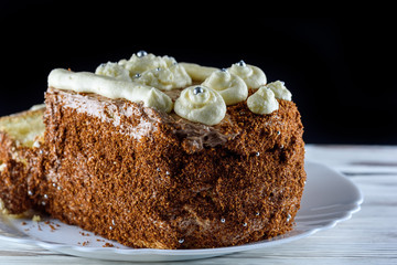 delicious home made biscuit cake on a black background
